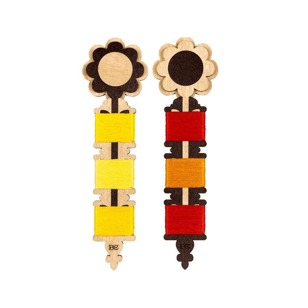 Plywood bobbins for threads, floss and ribbons.
