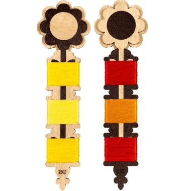 Plywood bobbins for threads, floss and ribbons.